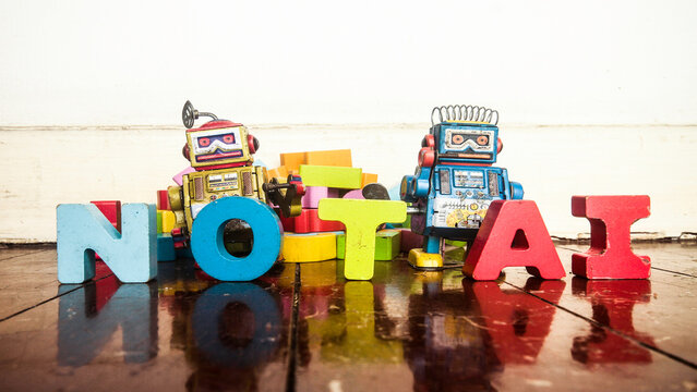 NOT AI with wooden letters and retro robots 