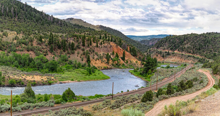 Naklejka premium Sunny summer valley. Scenic panorama of the Rocky Mountains