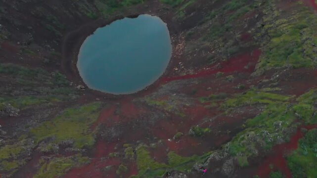 Panoramic drone view of Kerid volcanic crater under cloudy