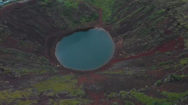 Aerial view of Kerid volcanic crater and blue lake in