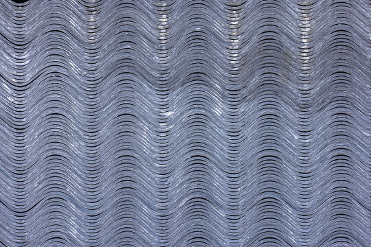 Stack of Wavy Asbestos Cement Roofing Tiles Texture Background