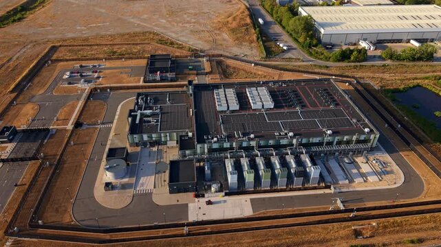 Aerial View of Hyperscale Data Center Rooftop with Cooling Units, Air Handlers and Solar Panels for AI Tech