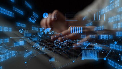 Obraz na płótnie Canvas A close-up view of hands typing on a keyboard, surrounded by data visualization overlays, showcasing modern technology and the importance of digital analysis in today environment. Xenic
