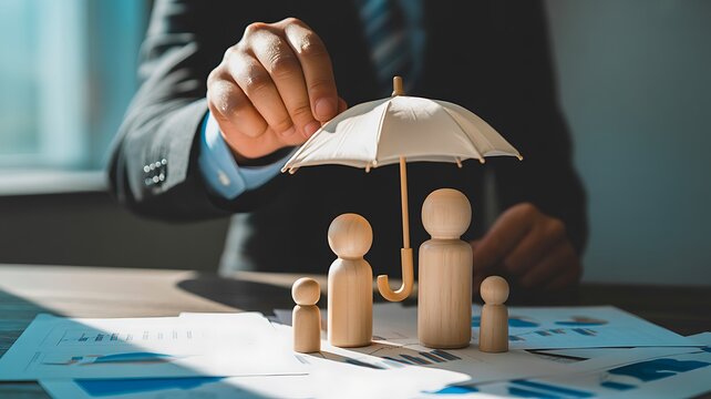  Business insurance and financial protection concept with umbrella covering family figures
