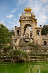 Fototapeta premium Barcelona, Catalonia, Spain, September 10 2025 Cascada Monumental Fountain at Parc de la Ciutadella in Barcelona Surrounded by Sculptures and Green Pond