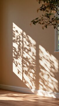 Window shadow grid pattern falling on beige wall