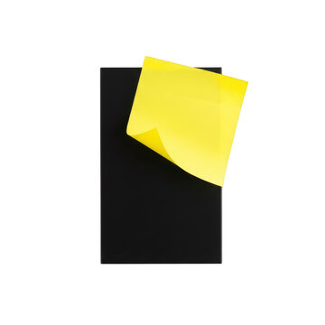 A yellow sticky note on a black rectangle isolated on transparent background