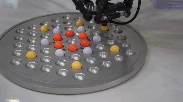 Robotic Arm use with vacuum system for holding small ball, Industrial 4.0 technology for modern factory management.