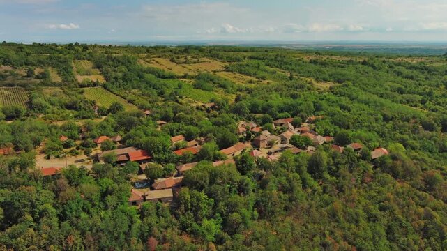 Aerial around view of old rustic vintage houses with wine cellars in Rogljevacke pivnice in Negotin region of Serbia, 4k