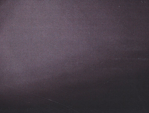 Close up of dark purple matte cardboard texture background.
