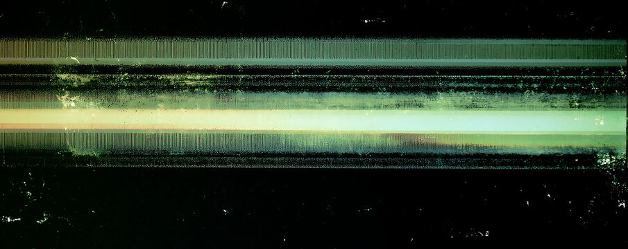 Abstract horizontal light trails with motion blur and luminous glow on black