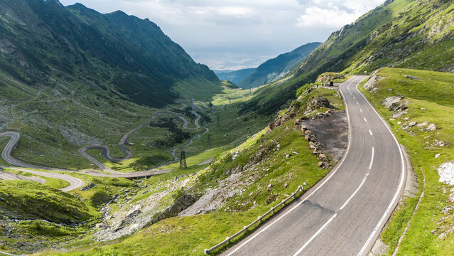 Winding Asphalt Road through Green Carpathian Valley