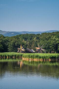 Scenic Lake Landscape with Traditional Windmill in Romania