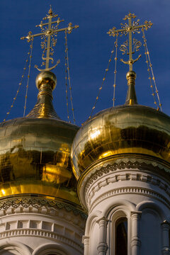 Karlovy Vary, Czech Republic. 7 August, 2026. The Church of Sts. Peter and Paul in Karlovy Vary. The gilded domes of the Orthodox church against a blue sky. Close-up. Religious theme. Vertical composi