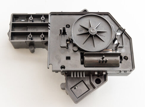 Black Plastic Appliance Part with Internal Features on White Background