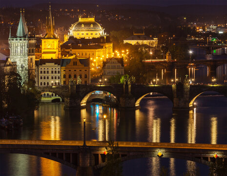 A travel Prague concept background - elevated view of bridges over Vltava river from Letna Park. Prague, Czech Republic in twilight