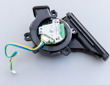 Miniature Blower Fan with Circuit Board and Wires on Gray Background