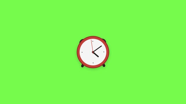 Red alarm clock with white face showing time, set against a plain green setting