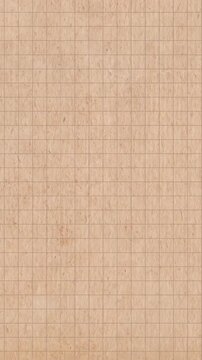 Stop motion video background of aged, textured paper with a checkered grid pattern. Kraft paper texture with a retro, vintage effect. Abstract vertical loop animation backdrop