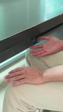 elderly asian man both hands shaking with bilateral parkinsonian tremor, parkinson's disease on two sides during the progressing stage of neurological disorder symptom, vertical video