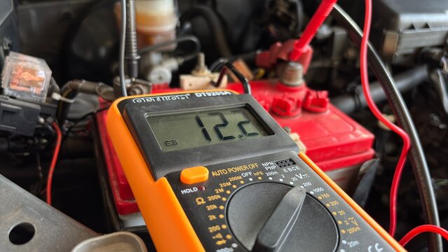 Car Battery Voltage Test with Digital Multimeter 12.2V