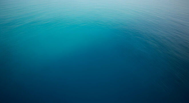 Abstract background featuring a smooth gradient transition from deep dark blue to a bright and vibrant light turquoise