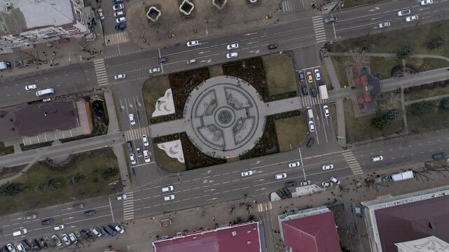 An aerial view of a central square in Krasnodar  Russia  showcasing urban infrastructure and traffic flow.