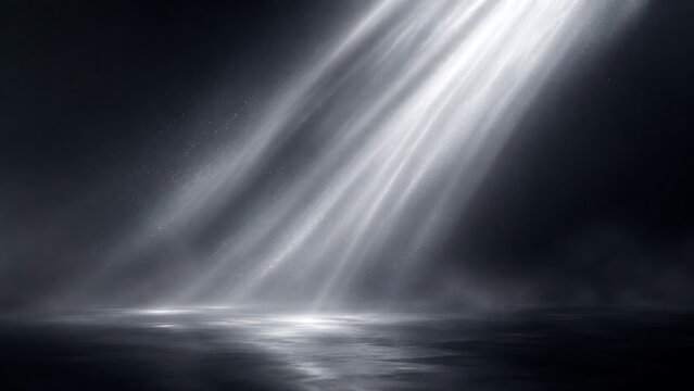 Dramatic volumetric light beams shining down onto a dark reflective surface in foggy space