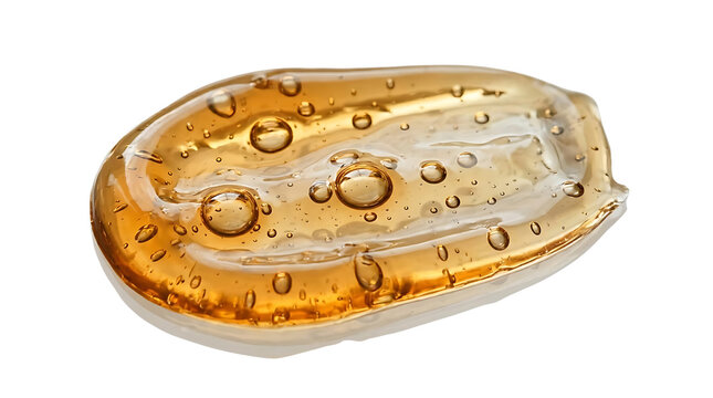 Golden cosmetic gel smudge with bubbles isolated on white