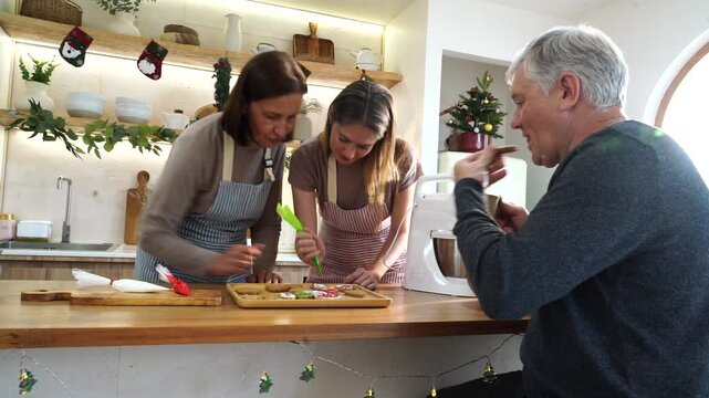The family&mdash;parents and daughter&mdash;did activities together, decorating gingerbread cookies with cream cheese and preparing food for a Thanksgiving and Christmas party at home.
