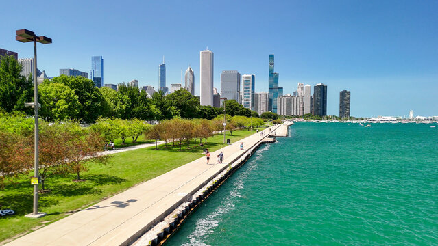 Aerial drone view of Chicago waterfront and skyline on sunny day