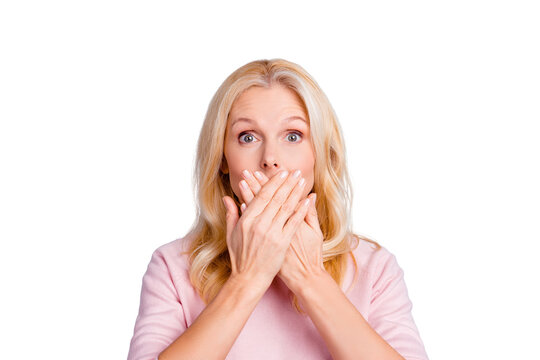 Close up portrait of funky curious cunning beautiful talkative gentle wondered astonished amazed lovely journalist grandmother grandma granny closes covers mouth isolated on gray background