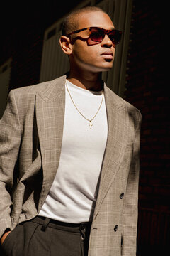 Close street fashion portrait of man in tailored blazer