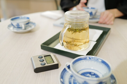 Transperrent tea pot with green tea 