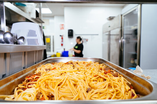 Freshly prepared pasta dish in a commercial restaurant kitchen