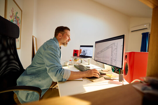 The architect works on his project in the home office.