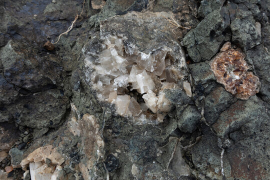 Geode showing natural calcite crystals growing inside a volcanic rock formation