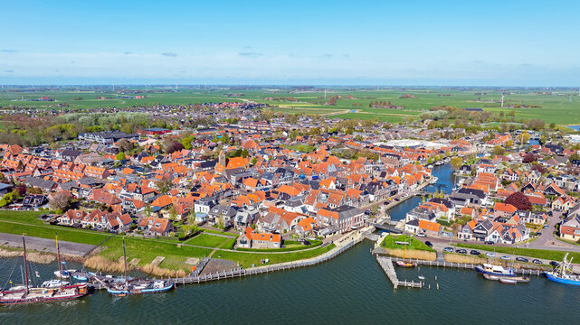 Aerial view of the historical town Makkum within a rural landscape in Friesland the Netherlands