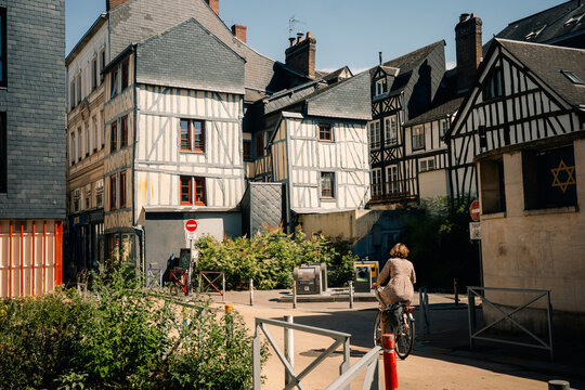 Biking Through Narrow Streets in a Historic Town in France