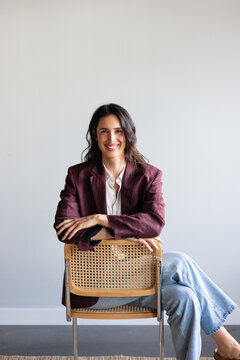 Cheerful woman sitting backwards