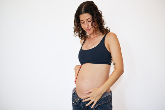 Pregnant woman touching belly