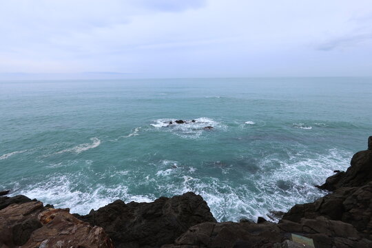 rocky coastline with sea foam