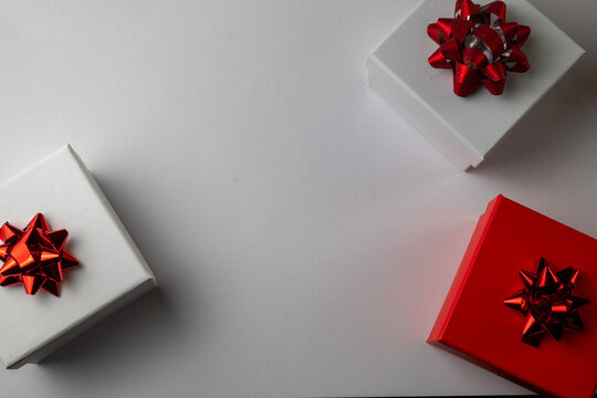 Decorative Gift Boxes With Red Bows on White Background