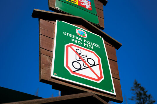 Entrance to a Protected Landscape Area. Text on the sign: Stezka pouze pro pě&scaron;&iacute; (translation from Czech: &ldquo;Pedestrian trail only&rdquo;). Regulations for hiking and tourism in the Czech Republic, Czechia.