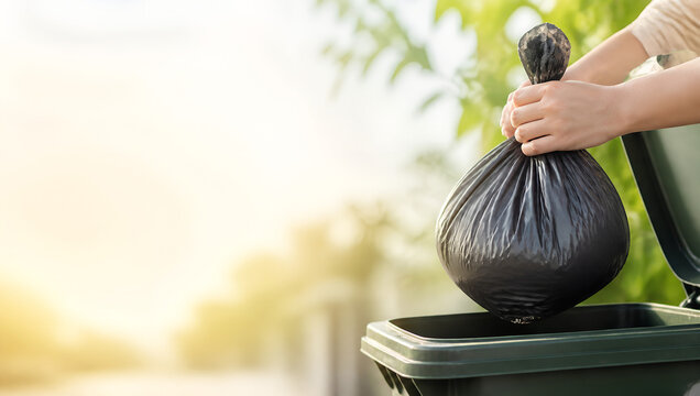 Person Taking Household Garbage Bag to Outdoor Trash Bin