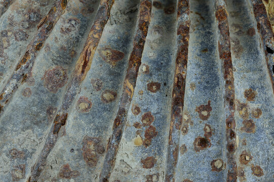 An eroded stovepipe as a sculptural relic. Scars of rust and ash yield to the cold of transition&mdash;a proud, fading monument to the departure from coal and fossil warmth.