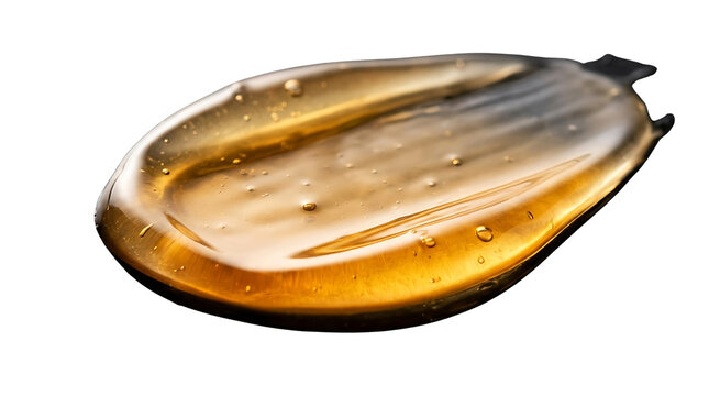 Golden cosmetic gel smear swatch with bubbles isolated on white background