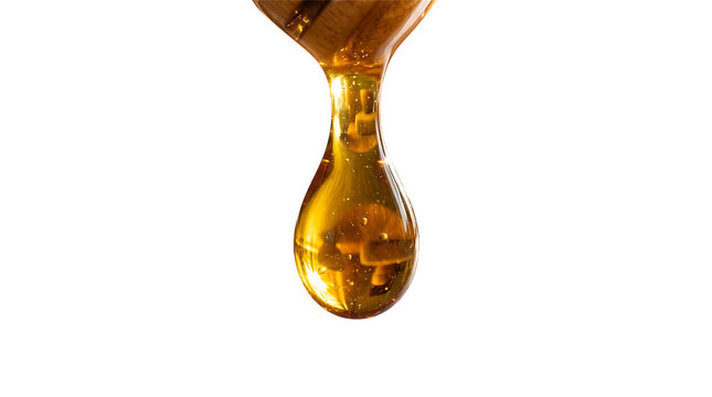 A Single Golden Honey Drop Dripping Down from a Wooden Dipper Isolated on a Clean White Background
