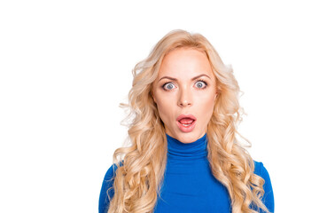 Naklejka premium Portrait of sexy, scared, impressed, shocked, stylish, pretty, cute, charming, nice, blonde woman in blue turtleneck with wide open eyes and mouth looking at camera