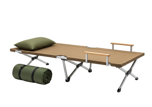 Portable folding camping cot with green pillow and roll mat for outdoor travel isolated on transparent background